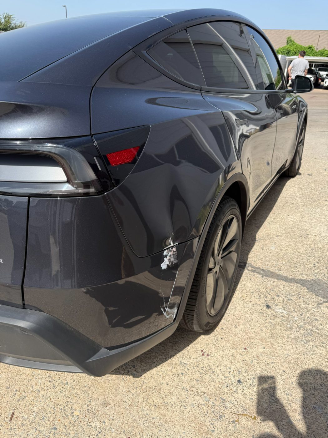 Tesla Model Y rear quarter gouged at the wheel arch before panel repair