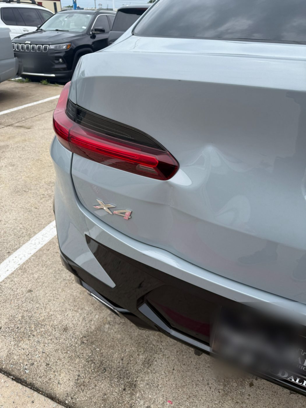BMW X4 rear quarter with a crease above the bumper before bodywork